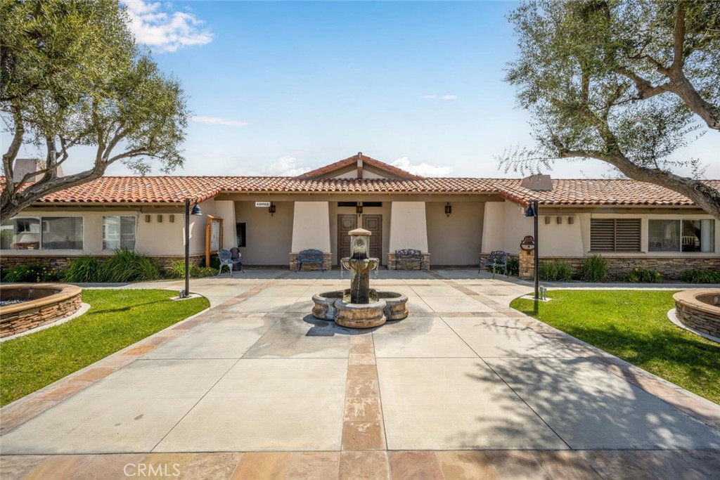 16222 Monterey Lane, Unit 371 Huntington Beach, CA 92649 - Photo 53 of 70 a front view of a house with a yard