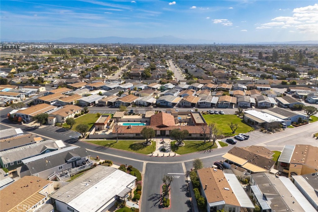 16222 Monterey Lane, Unit 371 Huntington Beach, CA 92649 - Photo 60 of 70 an aerial view of a city with lots of residential buildings and ocean view in back