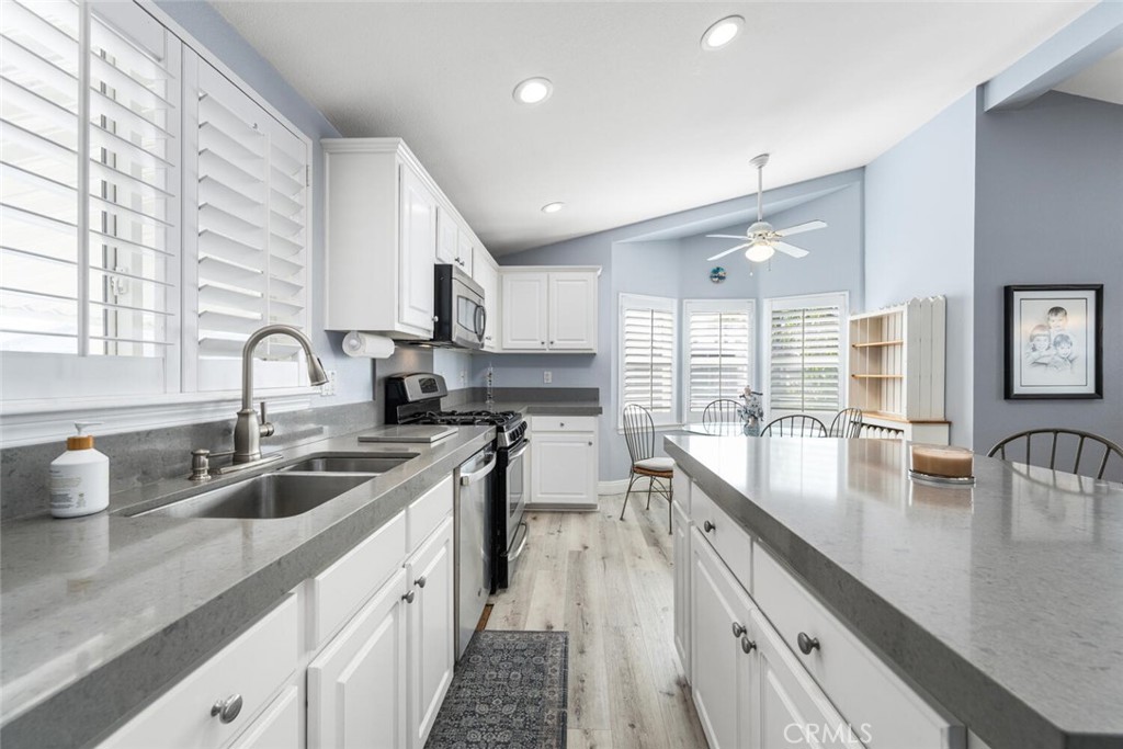 16222 Monterey Lane, Unit 371 Huntington Beach, CA 92649 - Photo 8 of 70 a large kitchen with sink a counter space and appliances