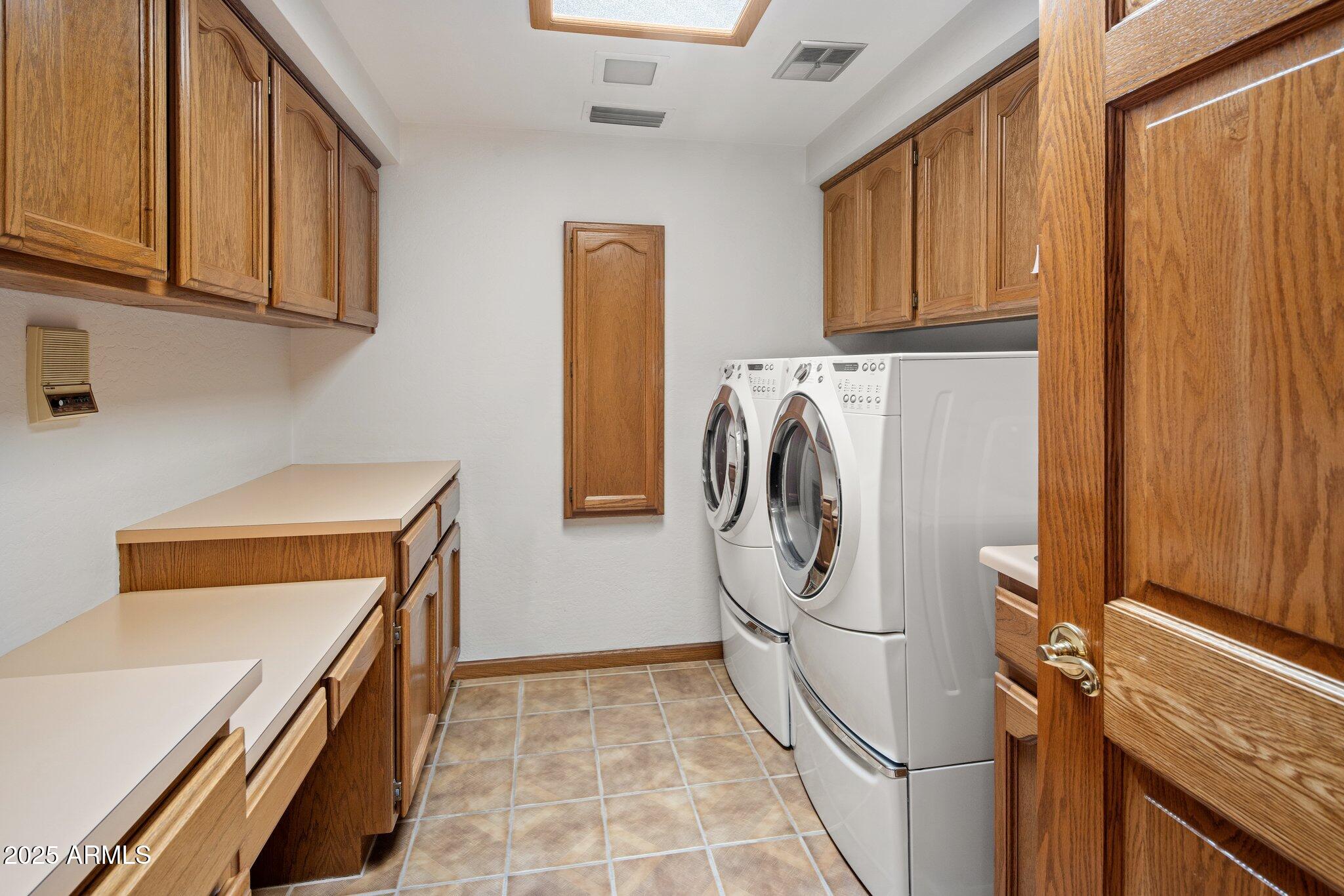 8815 North Invergordon Road Paradise Valley, AZ 85253 - Photo 14 of 22 a utility room with dryer and washer
