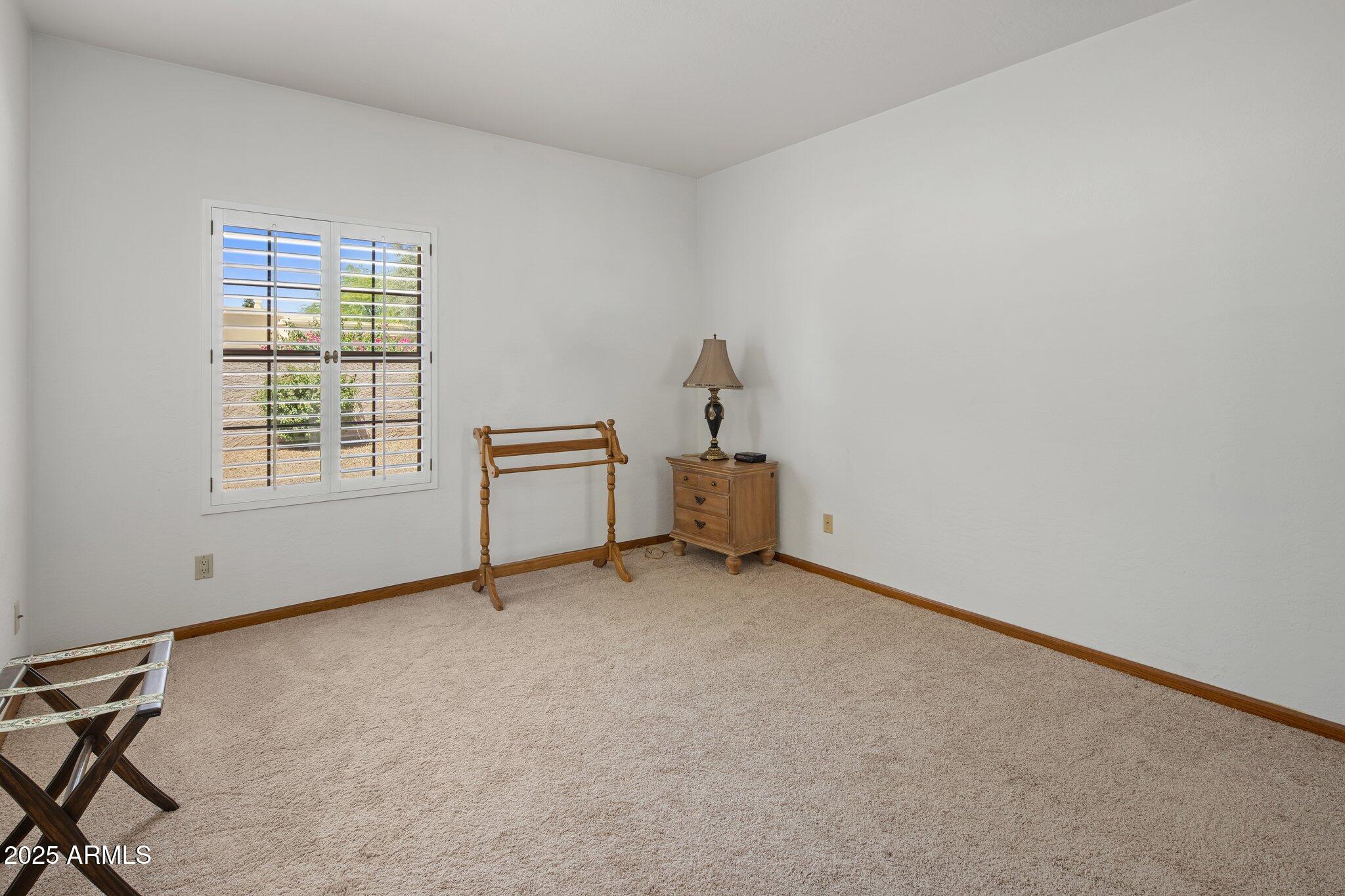8815 North Invergordon Road Paradise Valley, AZ 85253 - Photo 15 of 22 a view of an empty room with a window