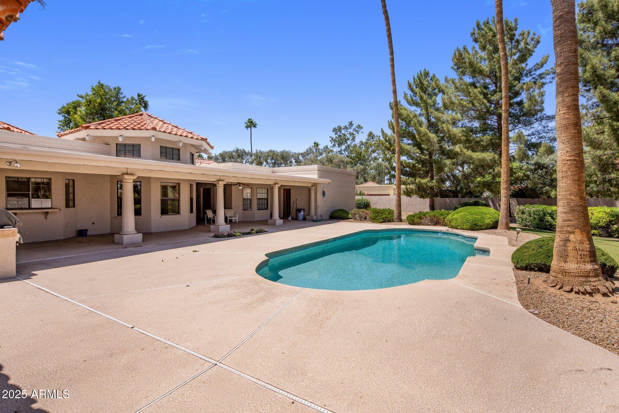 8815 North Invergordon Road Paradise Valley, AZ 85253 - Photo 17 of 22 a front view of a house with a yard