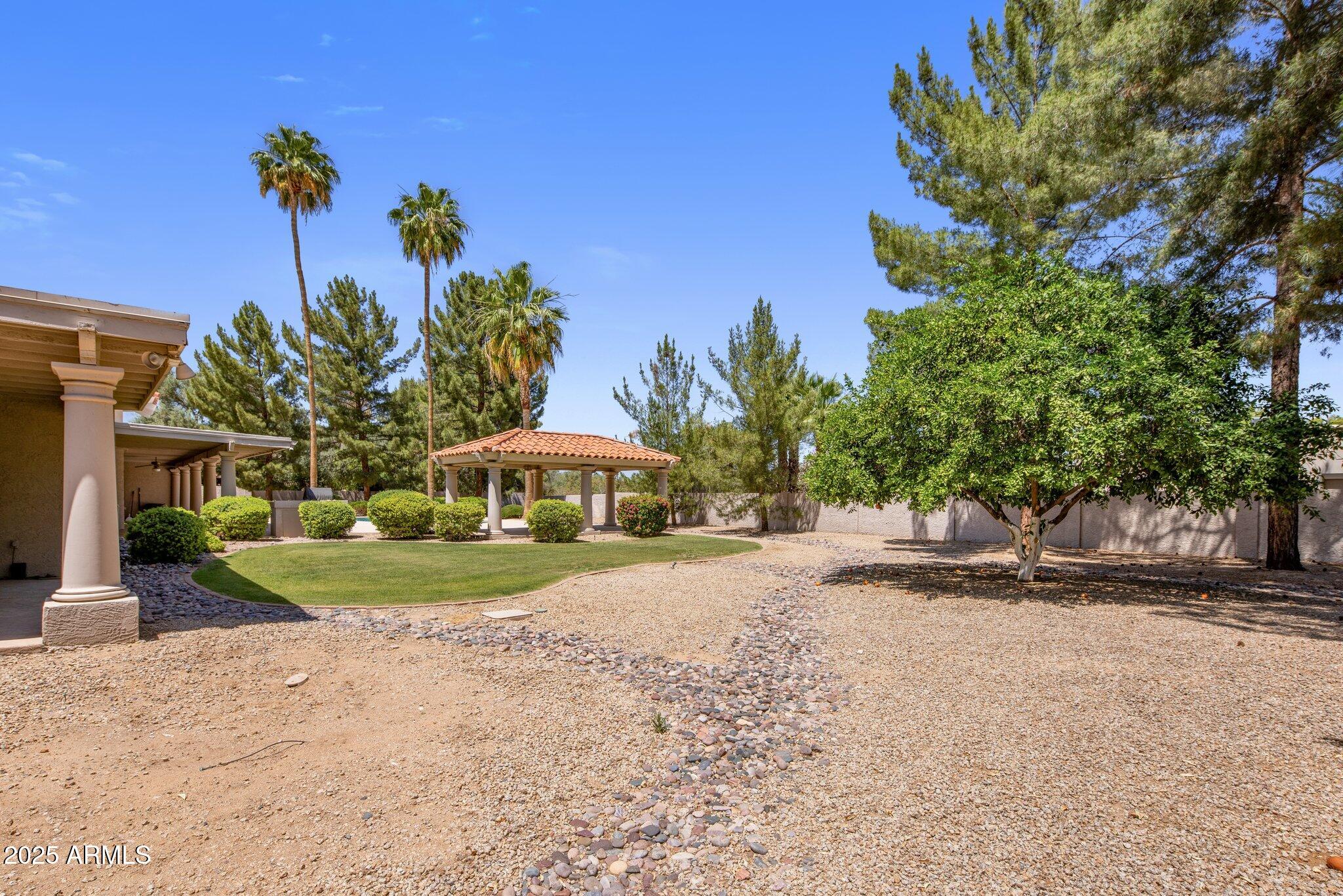 8815 North Invergordon Road Paradise Valley, AZ 85253 - Photo 19 of 22 a front view of a house with a yard and trees