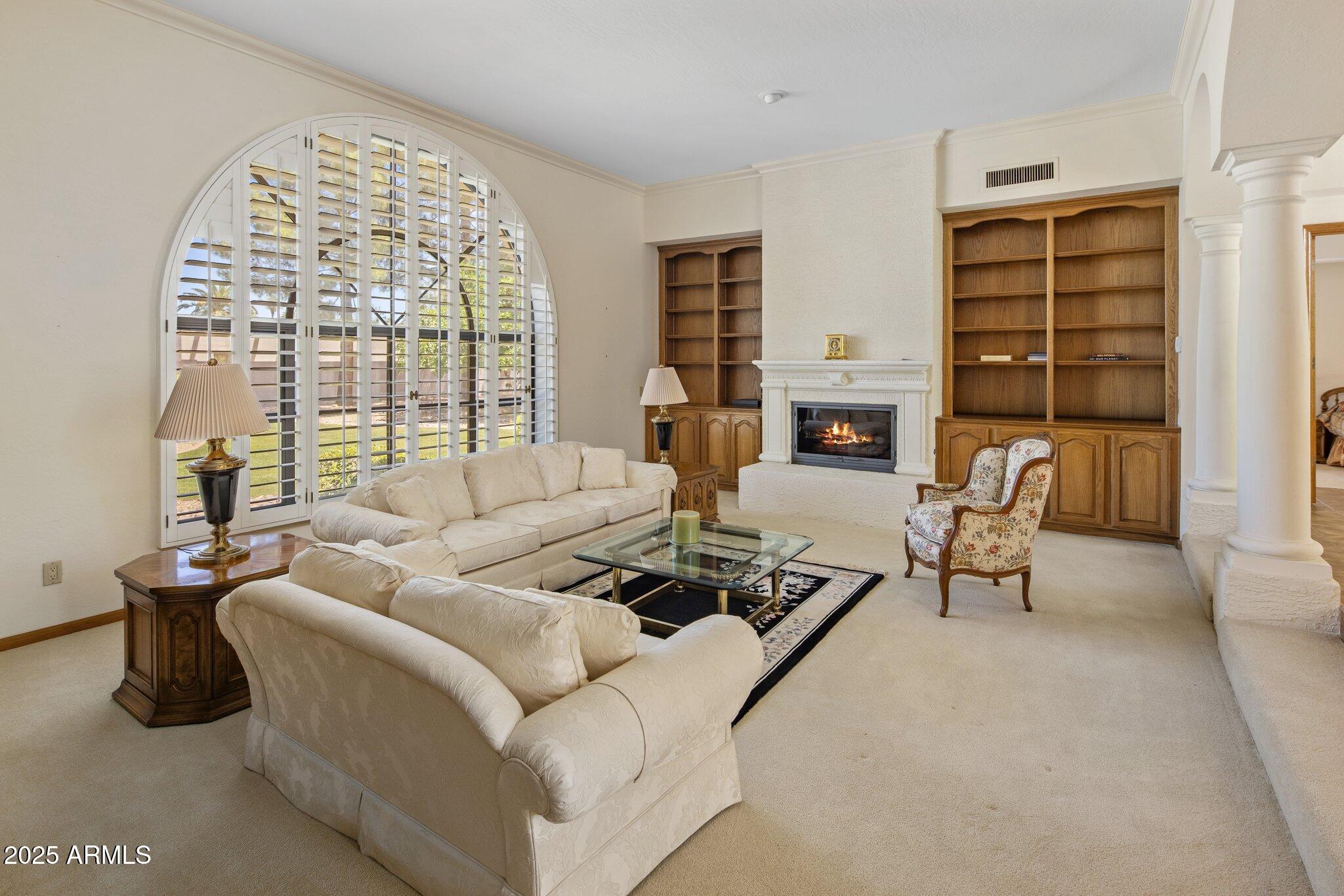 8815 North Invergordon Road Paradise Valley, AZ 85253 - Photo 6 of 22 a living room with furniture large window and tables