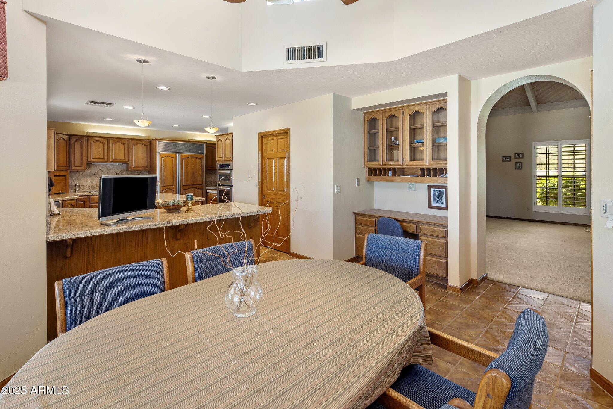 8815 North Invergordon Road Paradise Valley, AZ 85253 - Photo 8 of 22 a bedroom with a bed and with view of kitchen