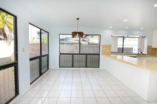 a view of a kitchen with windows