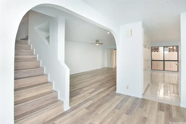 a view of entryway with wooden floor
