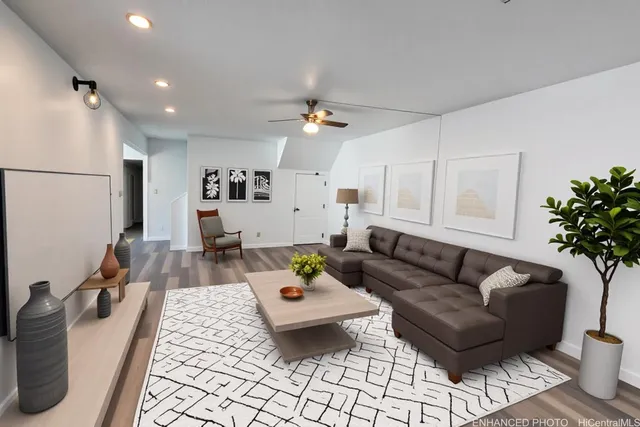 a living room with furniture and a chandelier