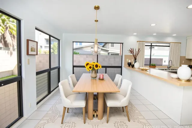 a dining room with furniture and window