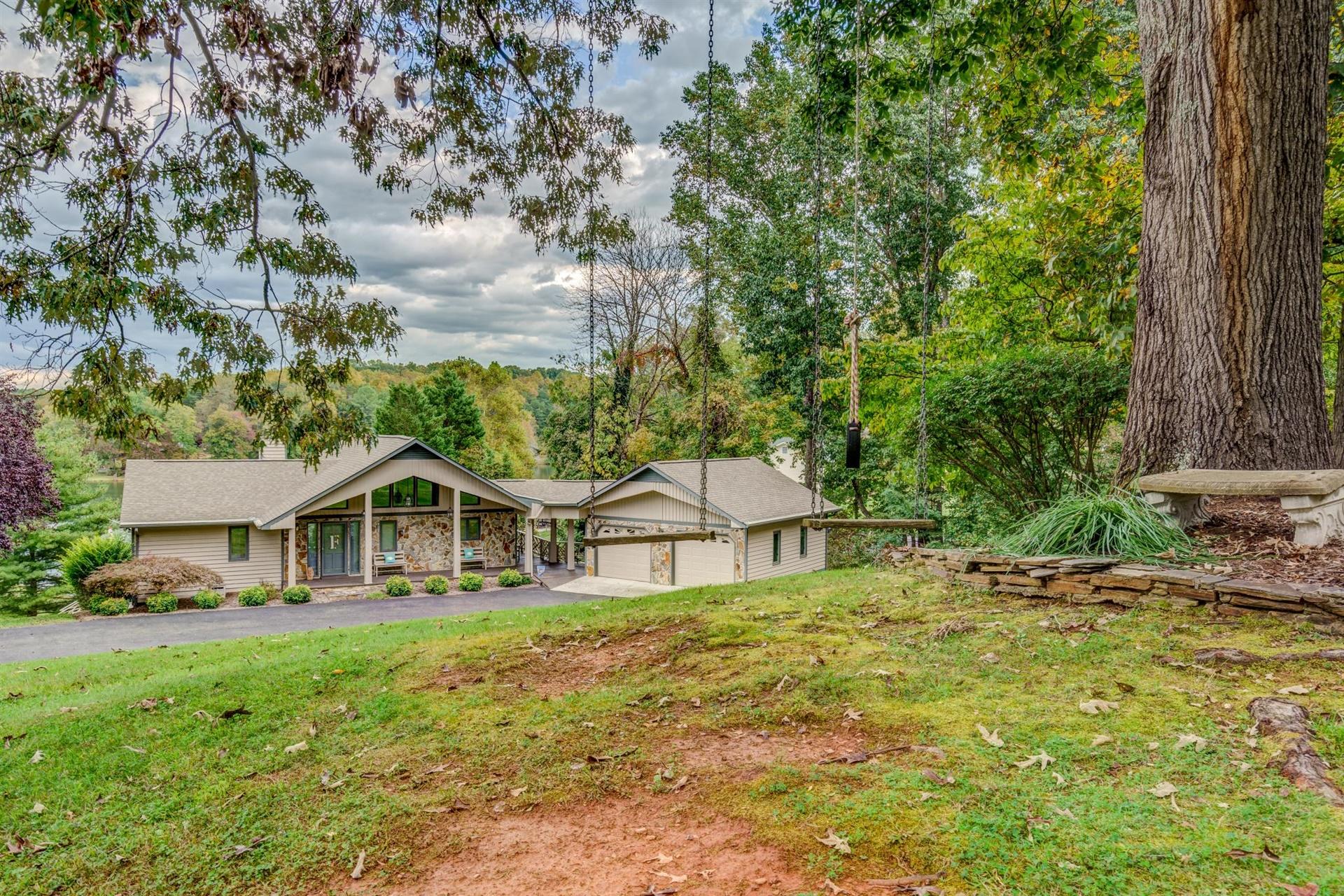 469 Cedar Ridge Road Union Hall, VA 24176 - Photo 50 of 54 a house with green field in front of it