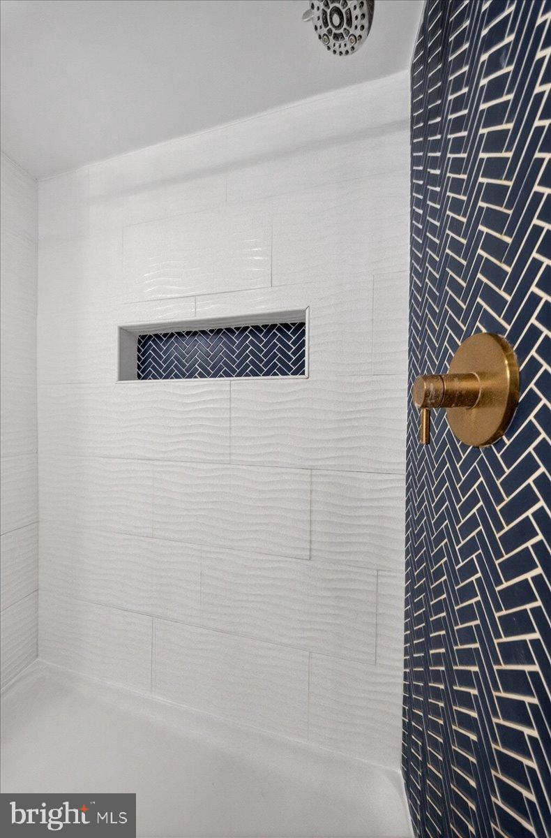 2505 West Denneys Road Dover, DE 19904 - Photo 27 of 68 Elegant shower with chic tile design.