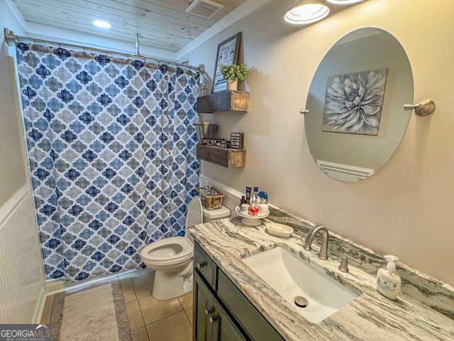 404 Hardwick Drive Macon, GA 31216 - Photo 16 of 21 a bathroom with a sink a toilet and a shower curtain