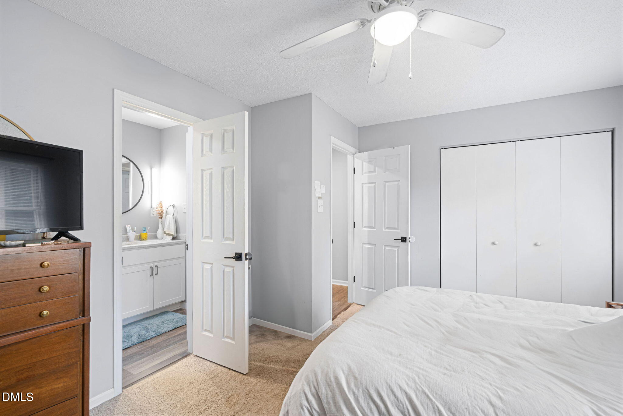 215 1/2 Lafayette Road, Unit A Raleigh, NC 27604 - Photo 23 of 39 a bedroom with a bed and a chandelier