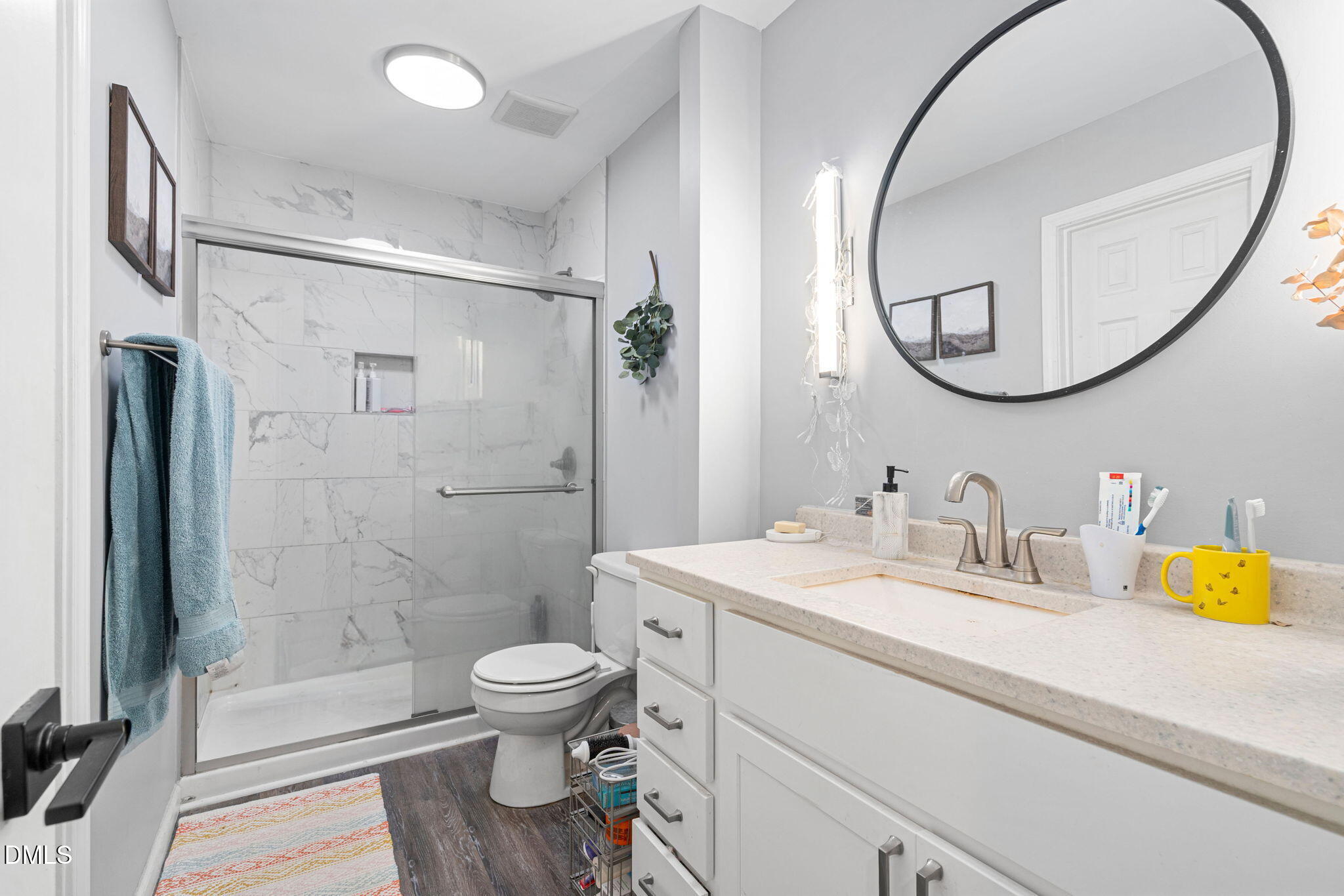 215 1/2 Lafayette Road, Unit A Raleigh, NC 27604 - Photo 24 of 39 a bathroom with a sink a toilet and a mirror