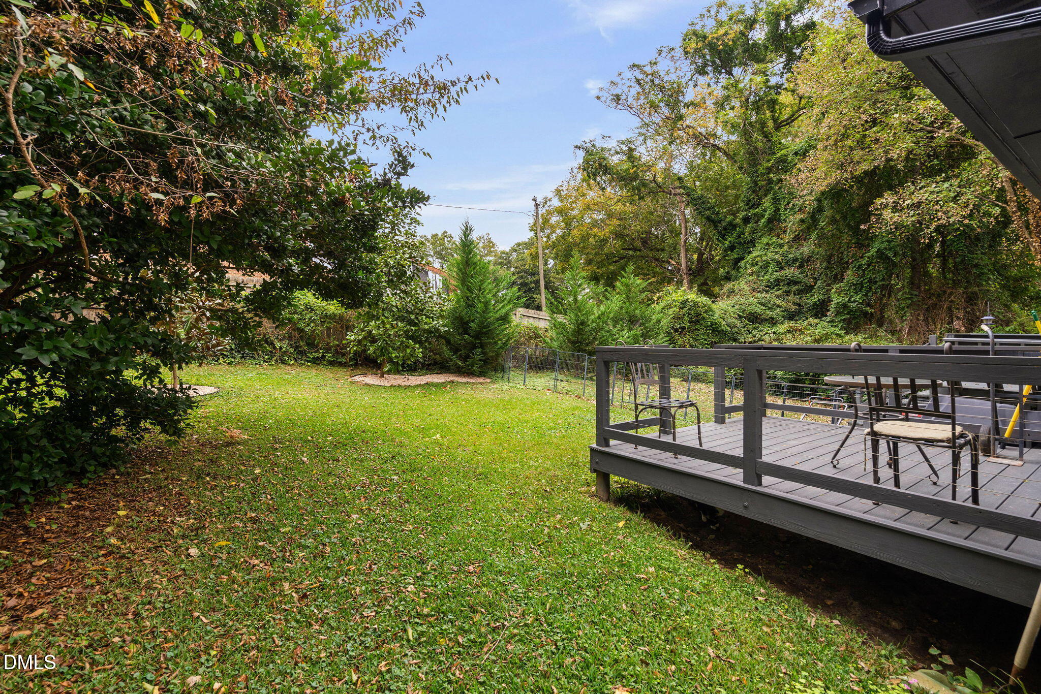 215 1/2 Lafayette Road, Unit A Raleigh, NC 27604 - Photo 39 of 39 a view of a wooden deck with a garden