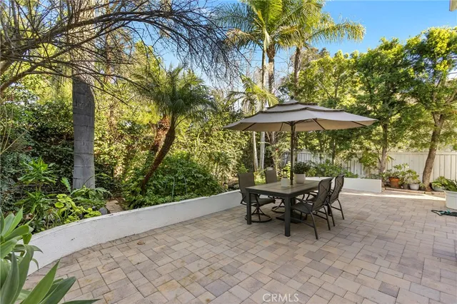 a view of a lounge chair in the patio next to a yard