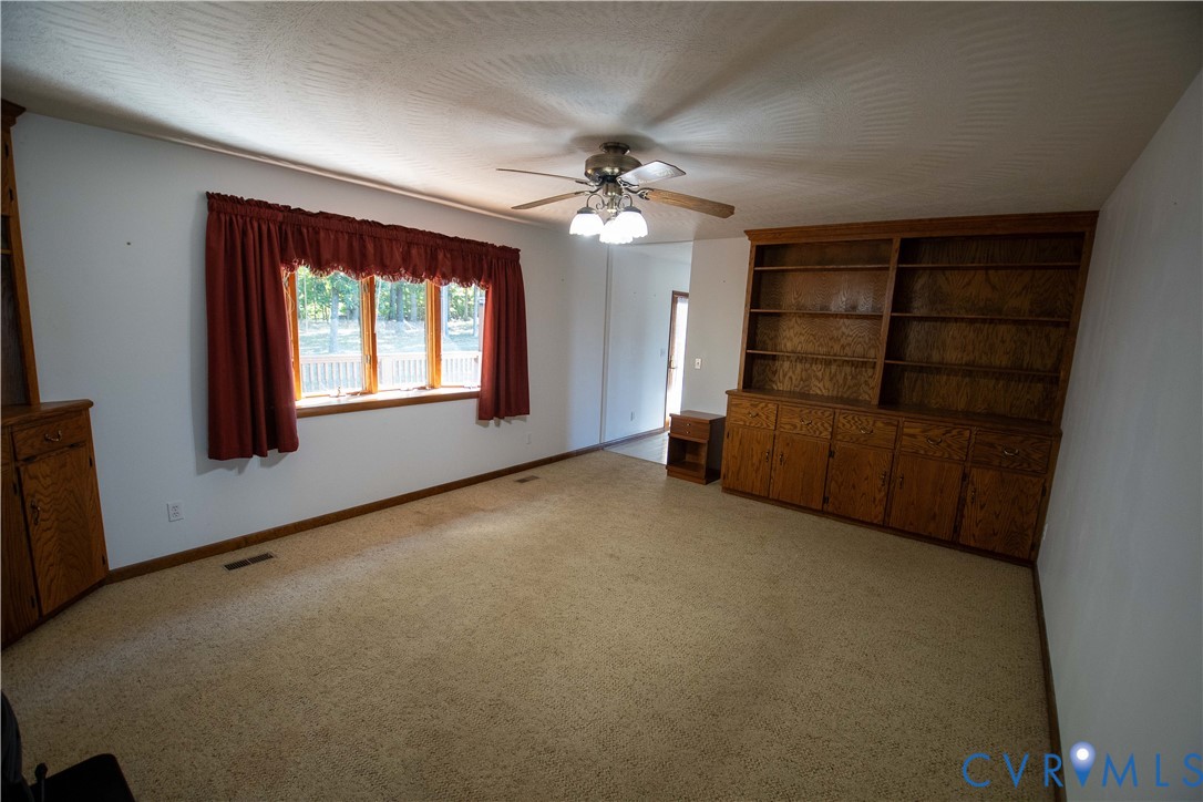 3574 Blose Road Elkton, VA 22827 - Photo 12 of 49 Unfurnished living room featuring ceiling fan and