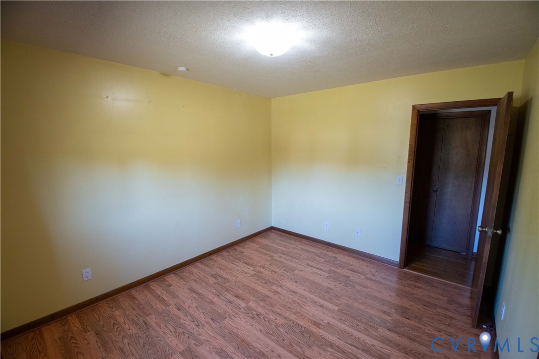 3574 Blose Road Elkton, VA 22827 - Photo 14 of 49 Unfurnished room with dark wood finished floors an