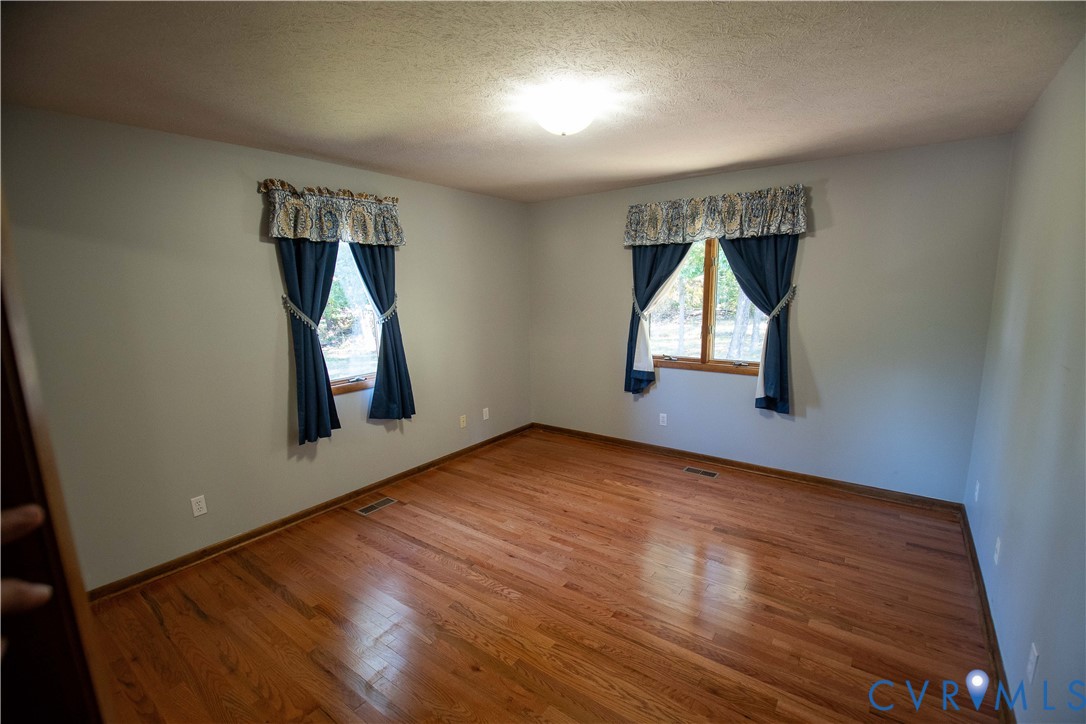 3574 Blose Road Elkton, VA 22827 - Photo 17 of 49 Spare room with wood finished floors and a texture
