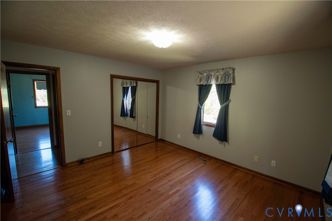 3574 Blose Road Elkton, VA 22827 - Photo 18 of 49 Unfurnished bedroom featuring wood finished floors