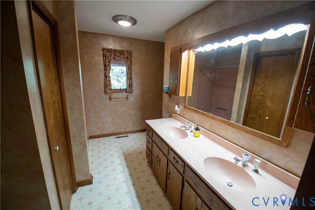 3574 Blose Road Elkton, VA 22827 - Photo 19 of 49 Full bathroom featuring double vanity and a shower