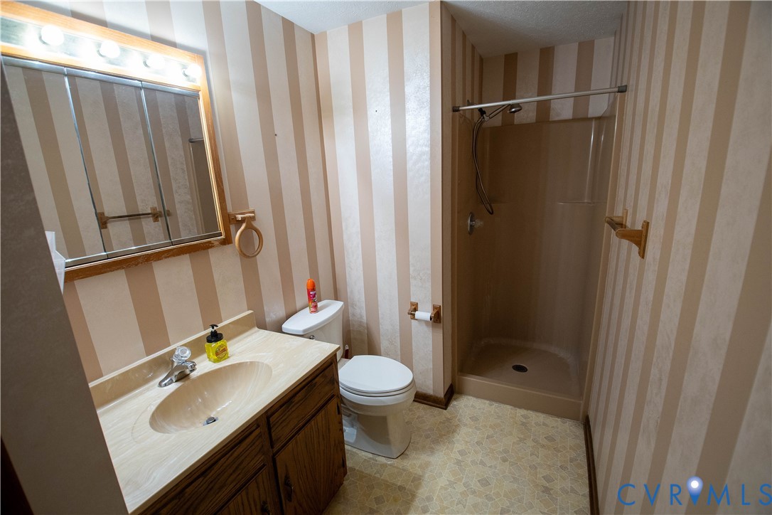 3574 Blose Road Elkton, VA 22827 - Photo 21 of 49 Bathroom featuring wallpapered walls, vanity, and
