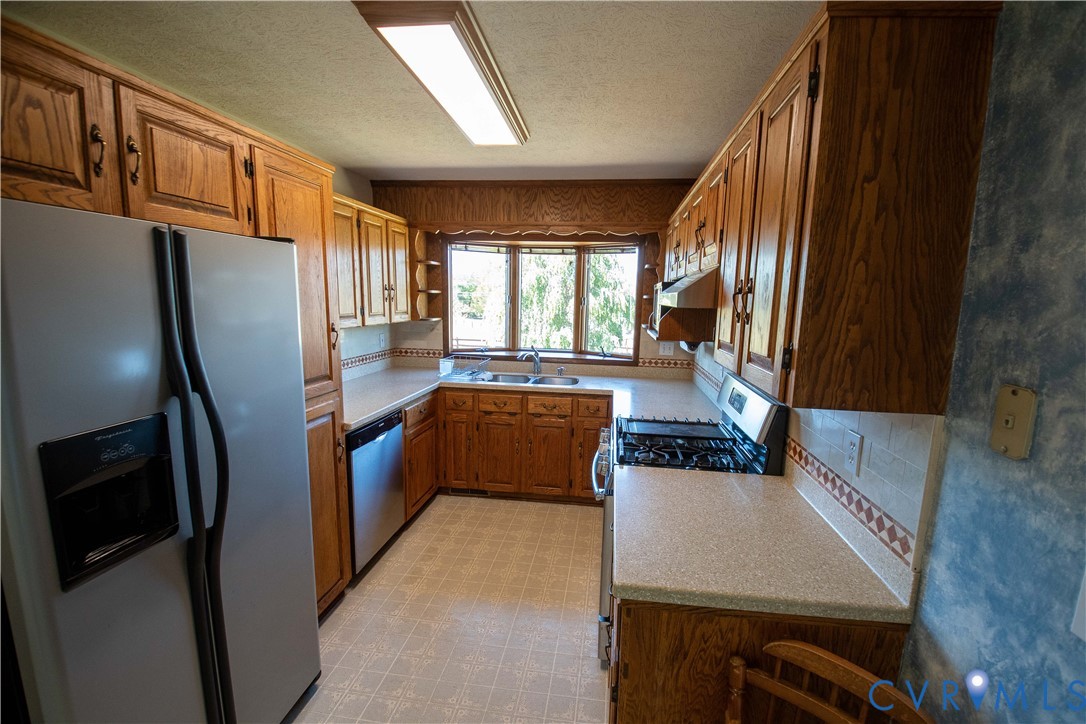 3574 Blose Road Elkton, VA 22827 - Photo 23 of 49 Kitchen with stainless steel appliances, light cou