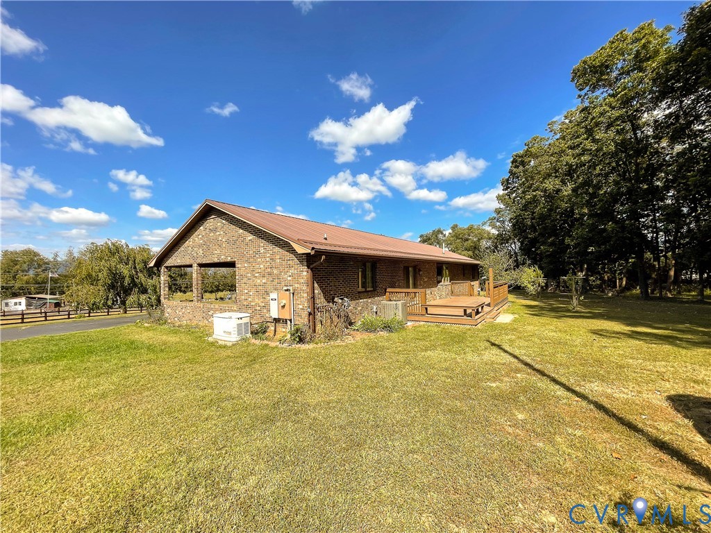 3574 Blose Road Elkton, VA 22827 - Photo 6 of 49 Back of house with a yard, brick siding, a deck, a