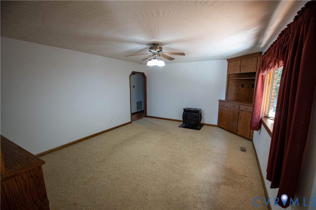 3574 Blose Road Elkton, VA 22827 - Photo 10 of 49 Unfurnished living room featuring a wood stove, li