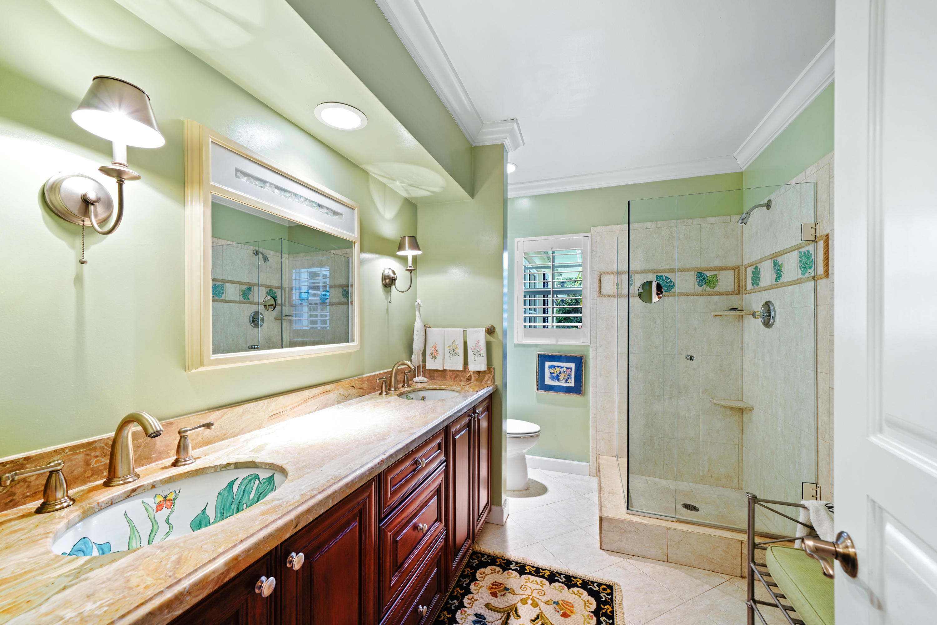 3232 Gulf Stream Road Gulf Stream, FL 33483 - Photo 17 of 36 a bathroom with a sink a mirror and a shower