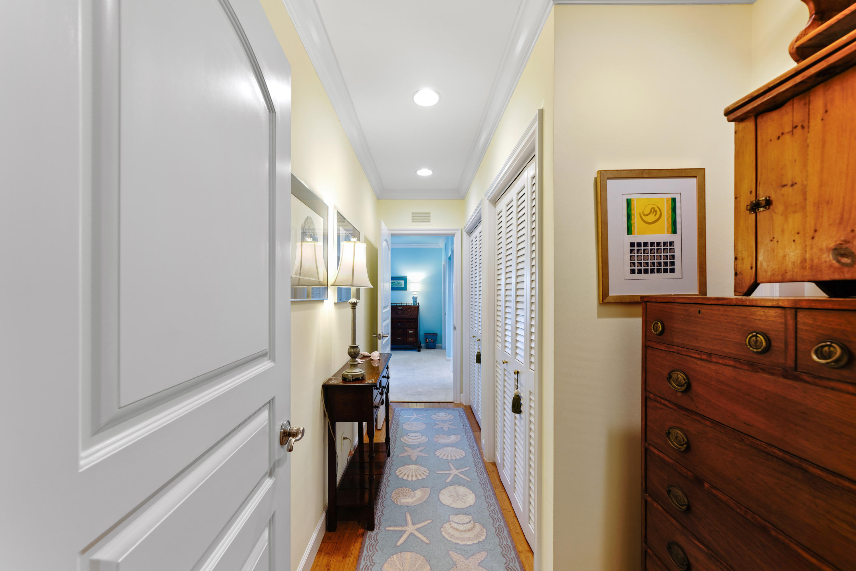 3232 Gulf Stream Road Gulf Stream, FL 33483 - Photo 19 of 36 a view of a hallway with a furniture and a mirror