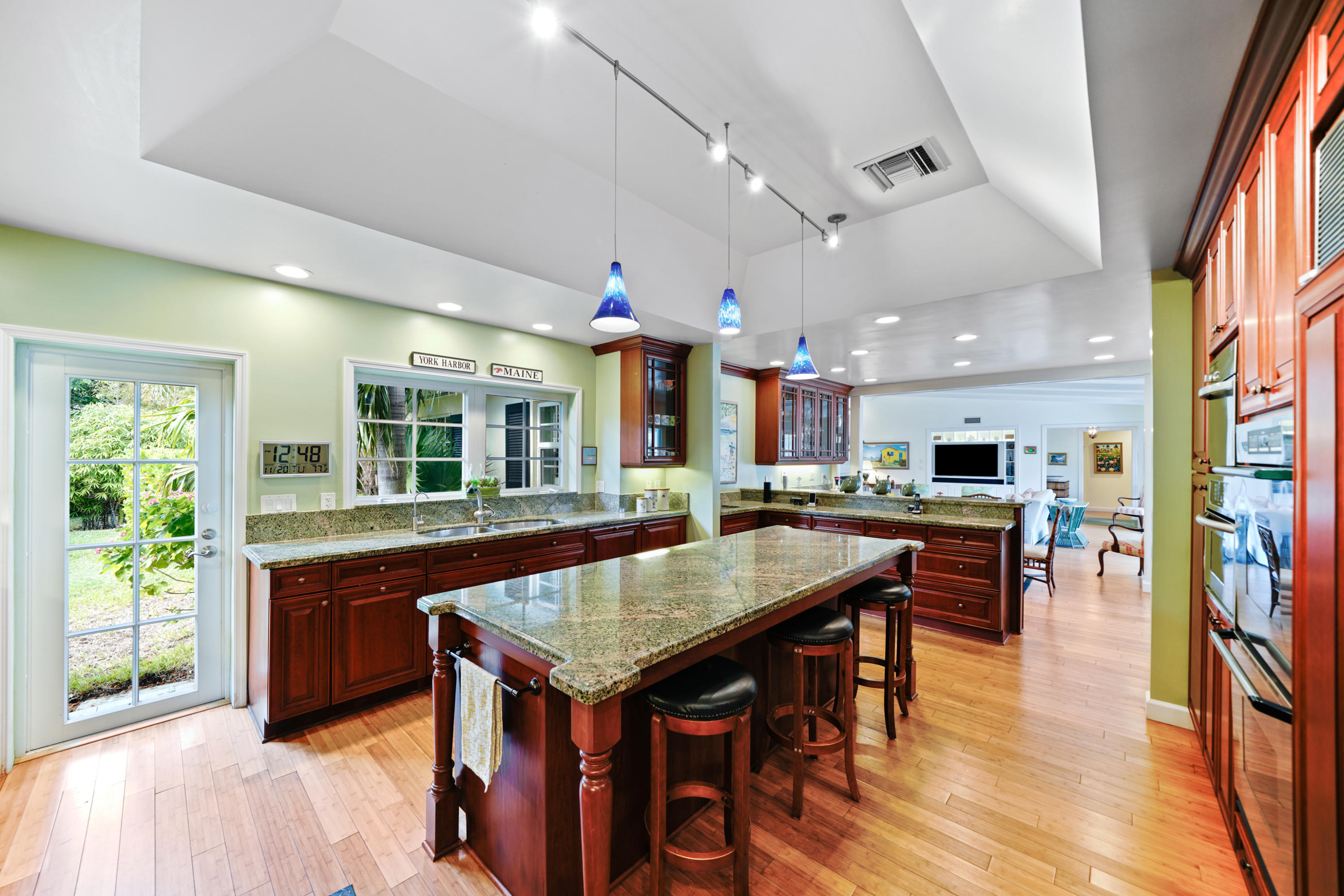 3232 Gulf Stream Road Gulf Stream, FL 33483 - Photo 27 of 36 an open kitchen with a table and chairs in it