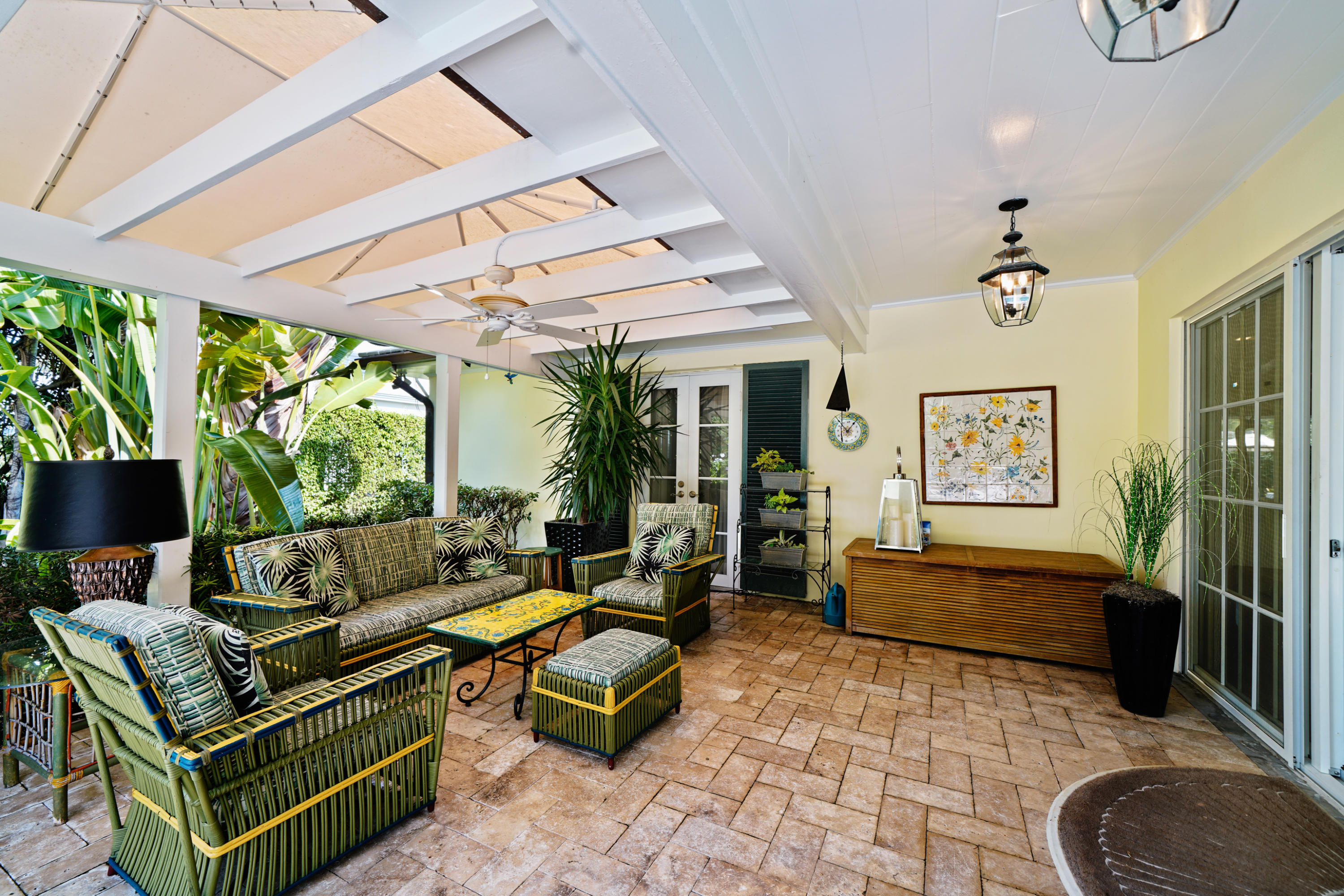 3232 Gulf Stream Road Gulf Stream, FL 33483 - Photo 29 of 36 a living room with patio furniture and a floor to ceiling window