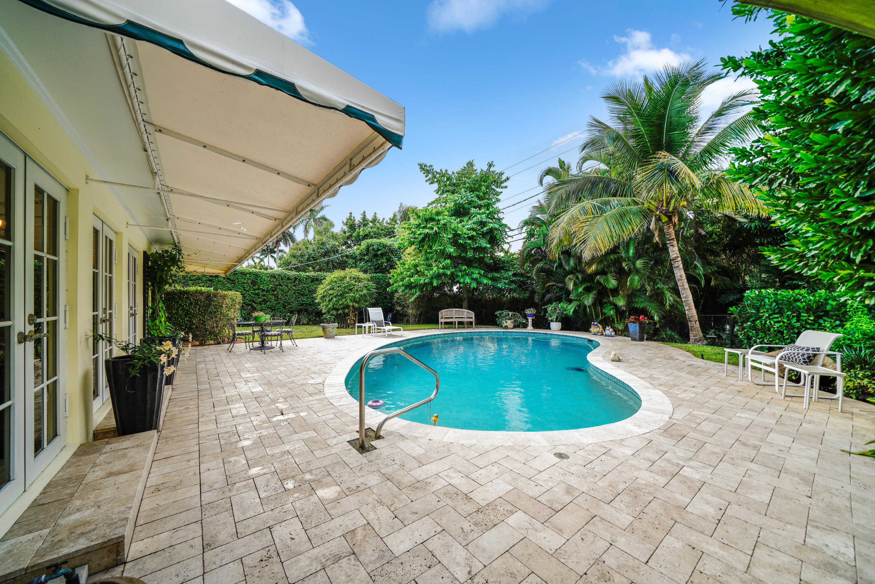 3232 Gulf Stream Road Gulf Stream, FL 33483 - Photo 33 of 36 a swimming pool with outdoor seating and yard