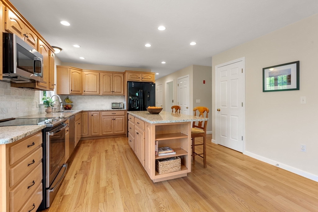 7 Brook Hill Road Sturbridge, MA 01518 - Photo 21 of 41 a kitchen with a sink a counter top space a large window and stainless steel appliances