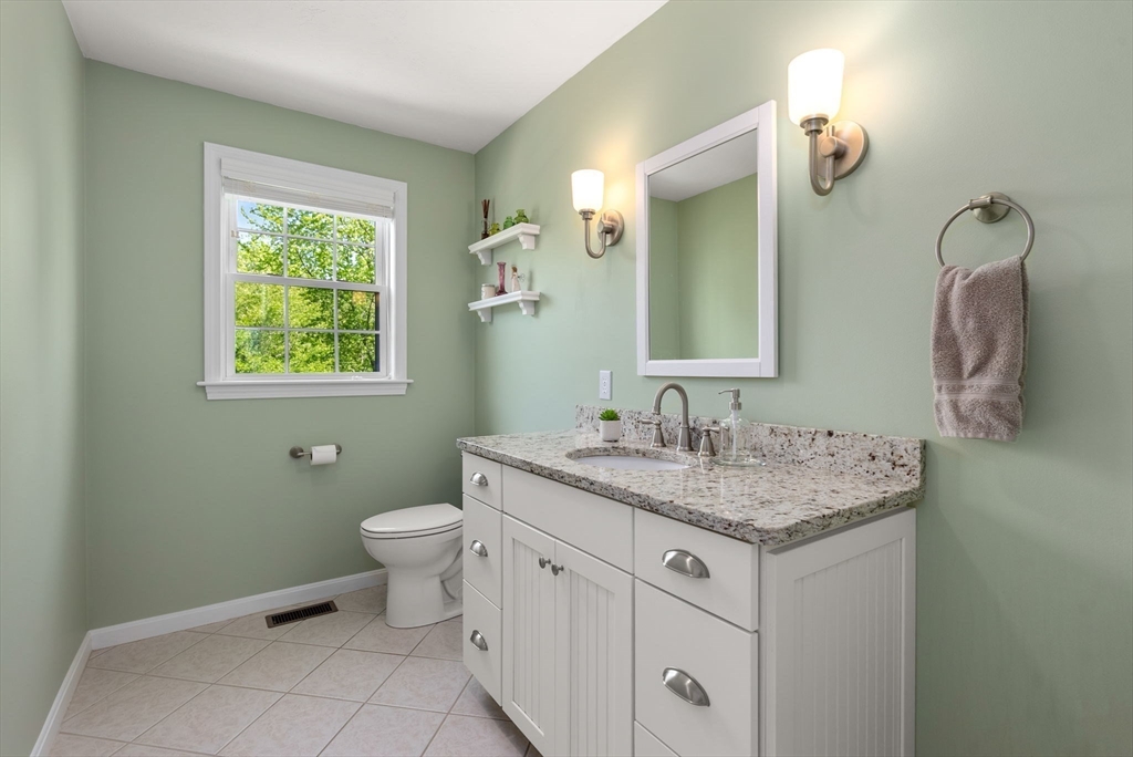 7 Brook Hill Road Sturbridge, MA 01518 - Photo 24 of 41 a bathroom with a granite countertop toilet sink and mirror