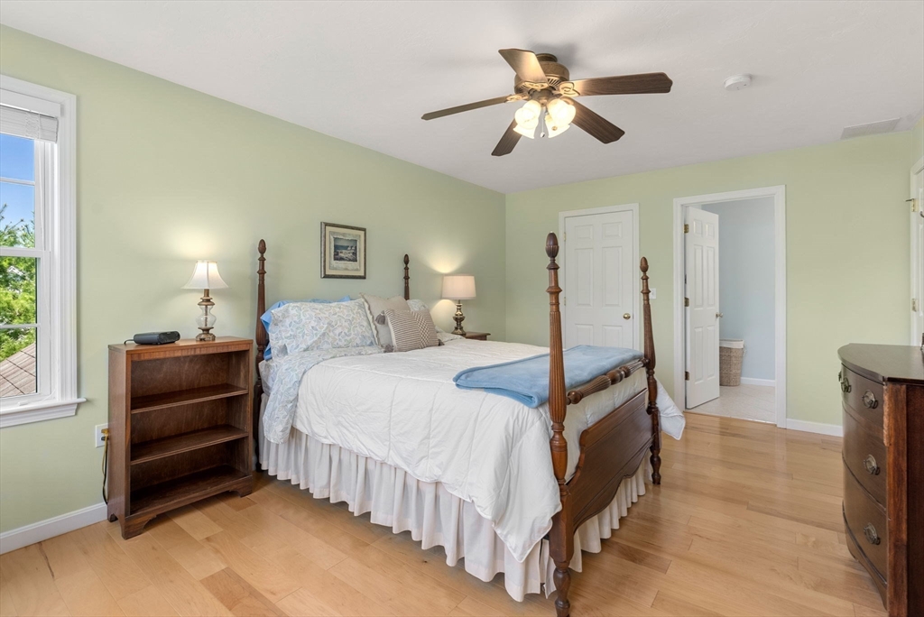 7 Brook Hill Road Sturbridge, MA 01518 - Photo 28 of 41 a bedroom with a bed and a ceiling fan