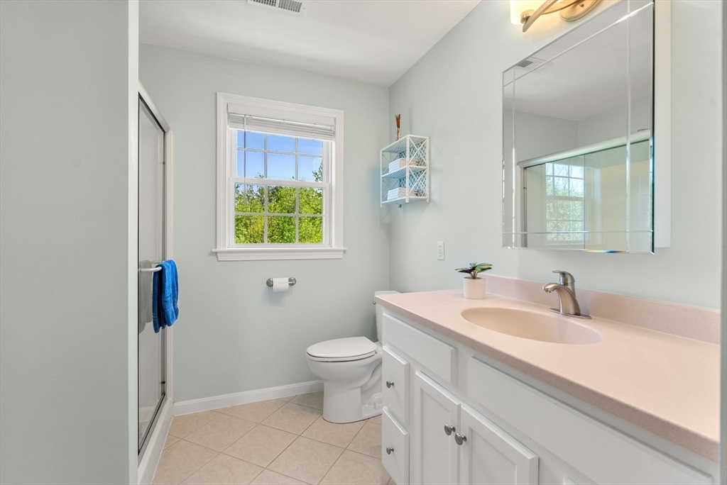 7 Brook Hill Road Sturbridge, MA 01518 - Photo 29 of 41 a bathroom with a toilet sink and mirror