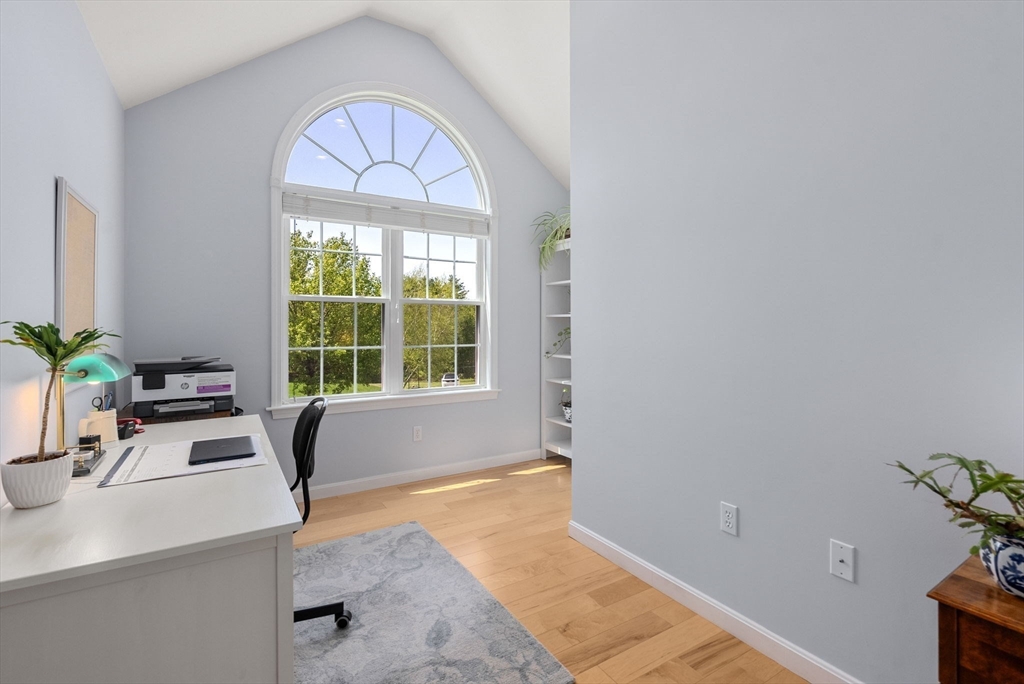 7 Brook Hill Road Sturbridge, MA 01518 - Photo 32 of 41 a view of a room that has a couch and a potted plant in it