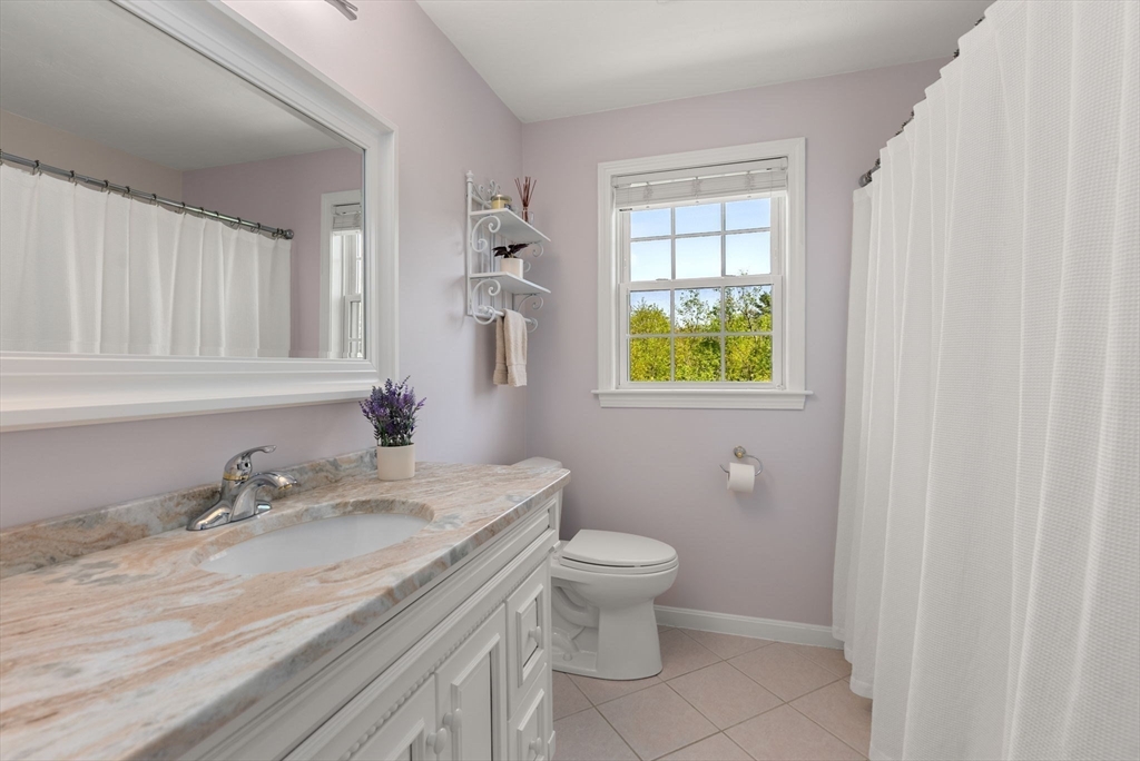 7 Brook Hill Road Sturbridge, MA 01518 - Photo 33 of 41 a bathroom with a granite countertop sink toilet and a mirror