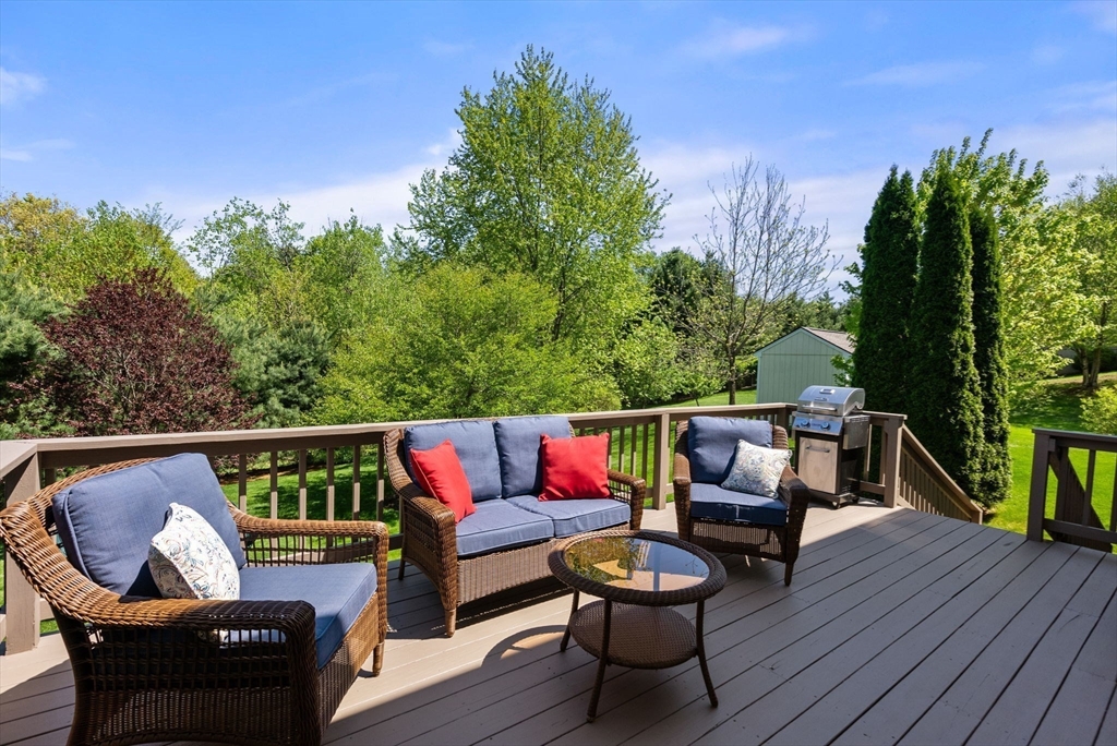 7 Brook Hill Road Sturbridge, MA 01518 - Photo 35 of 41 a balcony with wooden floor and outdoor seating