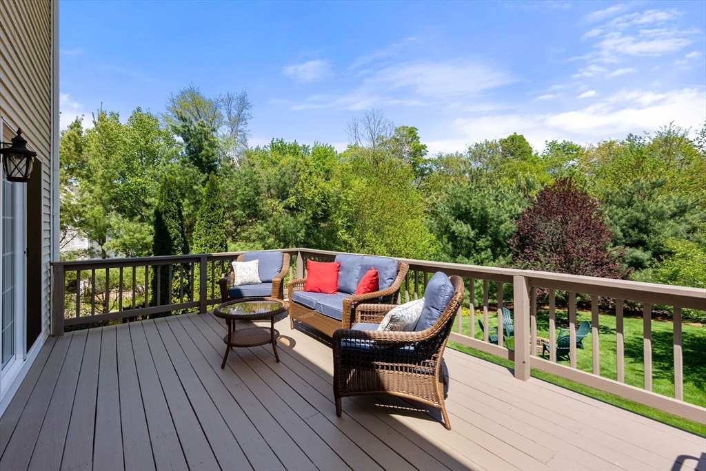 7 Brook Hill Road Sturbridge, MA 01518 - Photo 36 of 41 a balcony with wooden floor and outdoor seating