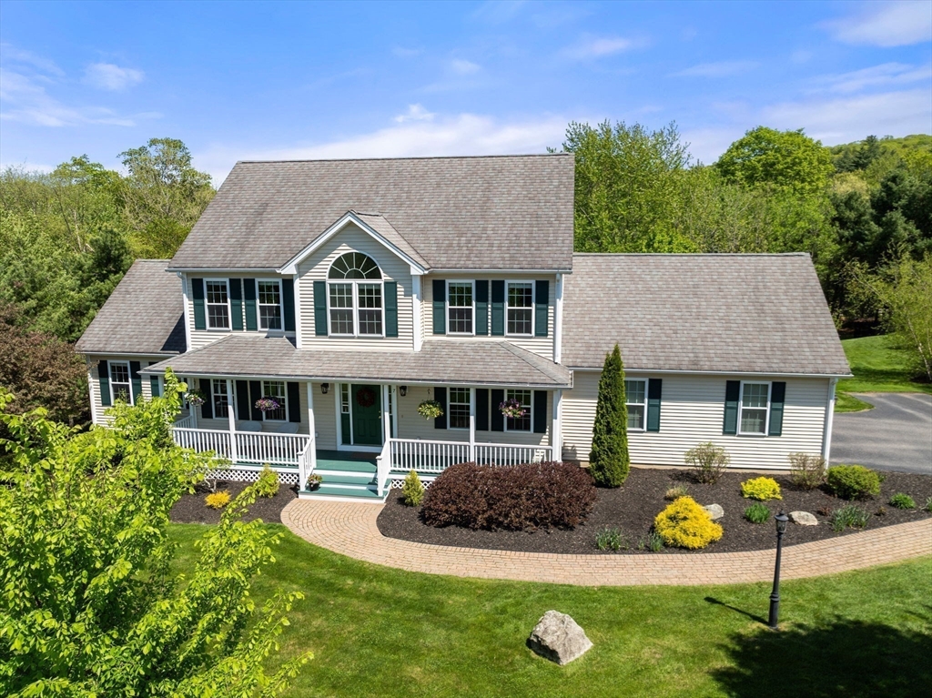 7 Brook Hill Road Sturbridge, MA 01518 - Photo 5 of 41 a front view of a house with yard and green space