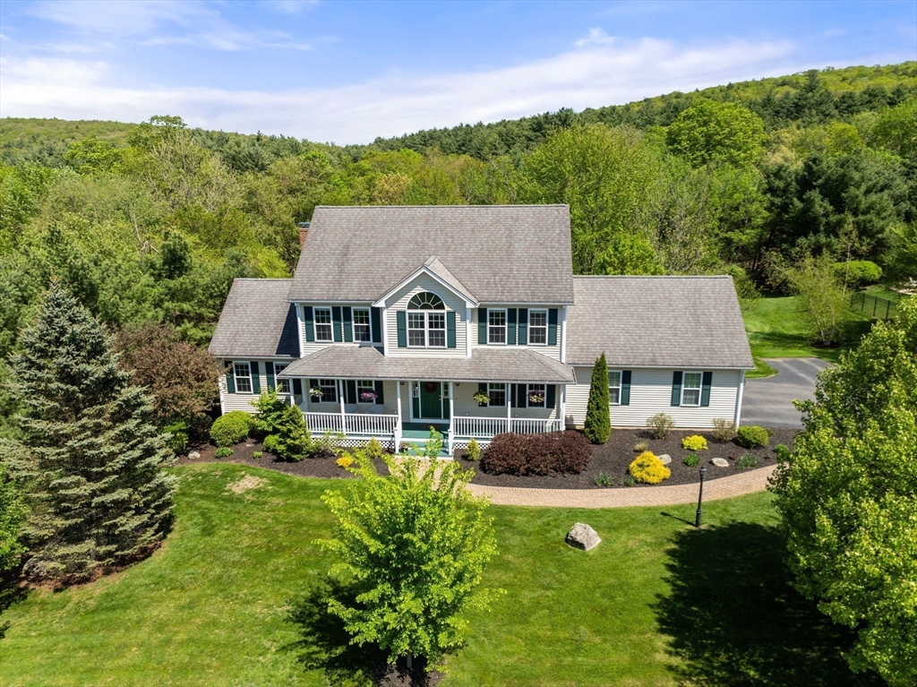 7 Brook Hill Road Sturbridge, MA 01518 - Photo 7 of 41 a aerial view of a house with swimming pool and green space