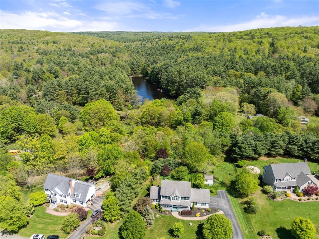 7 Brook Hill Road Sturbridge, MA 01518 - Photo 9 of 41 view of a city with lush green forest