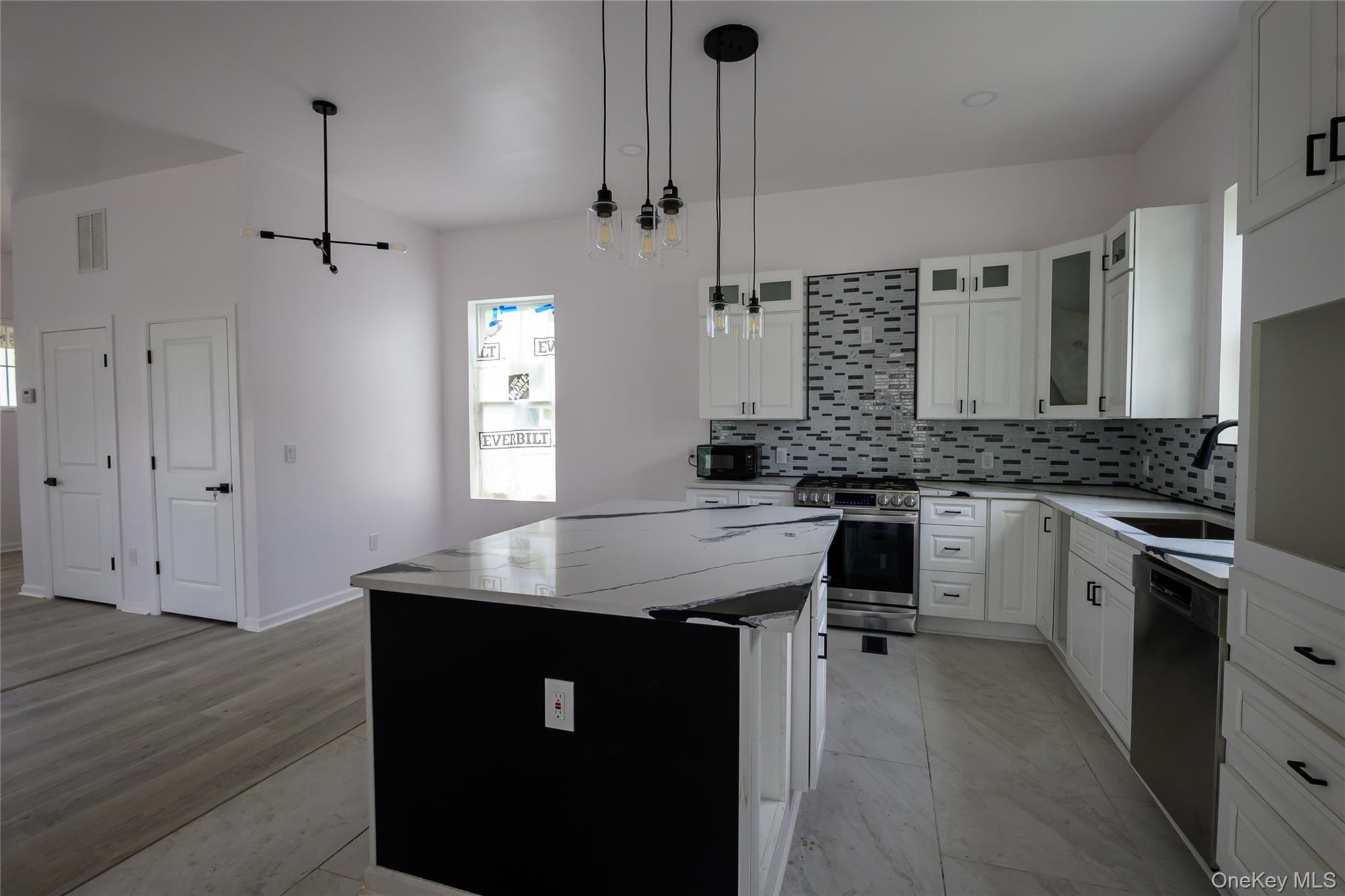 81 Silver Lake Sctn Road Middletown, NY 10940 - Photo 11 of 37 a kitchen with granite countertop a sink cabinets and wooden floor