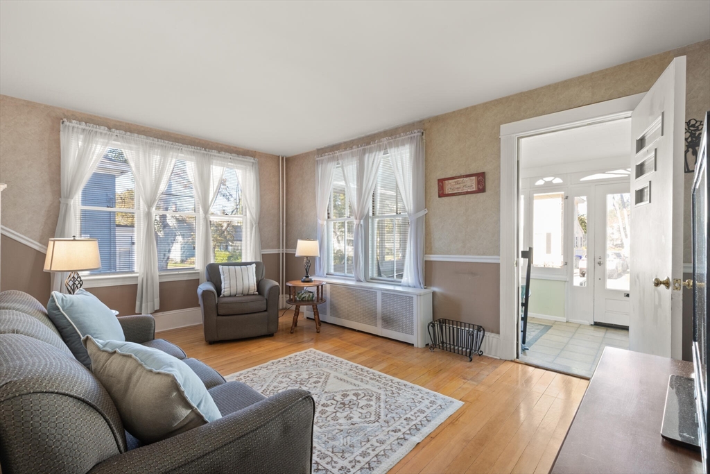 35 Roosevelt Street, Unit 35 Maynard, MA 01754 - Photo 11 of 39 a living room with furniture and a large window