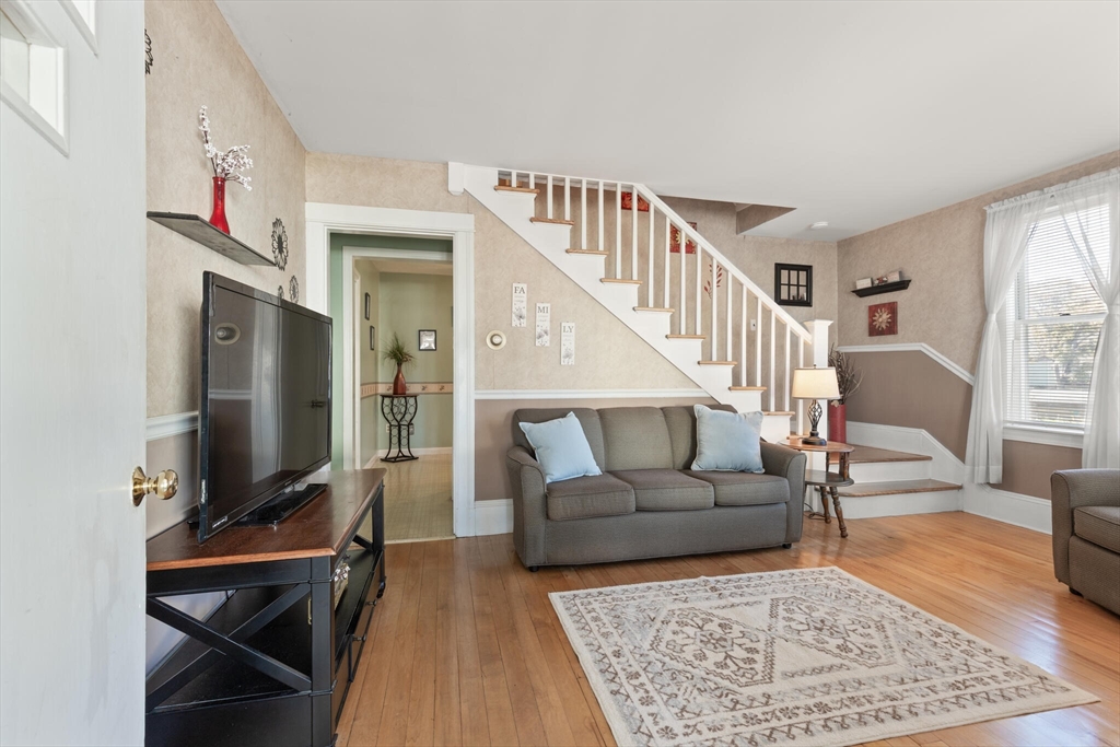 35 Roosevelt Street, Unit 35 Maynard, MA 01754 - Photo 12 of 39 a living room with furniture and a flat screen tv