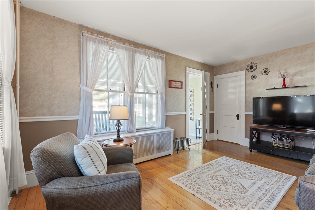35 Roosevelt Street, Unit 35 Maynard, MA 01754 - Photo 13 of 39 a living room with furniture and a flat screen tv