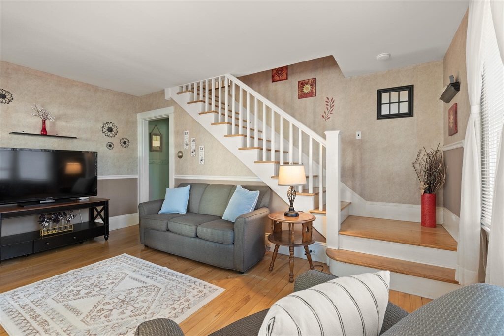 35 Roosevelt Street, Unit 35 Maynard, MA 01754 - Photo 14 of 39 a living room with furniture and a flat screen tv